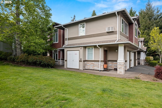 view of front of home featuring a front lawn, stone siding, and a garage