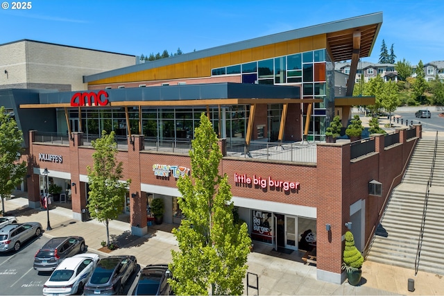 view of property featuring uncovered parking
