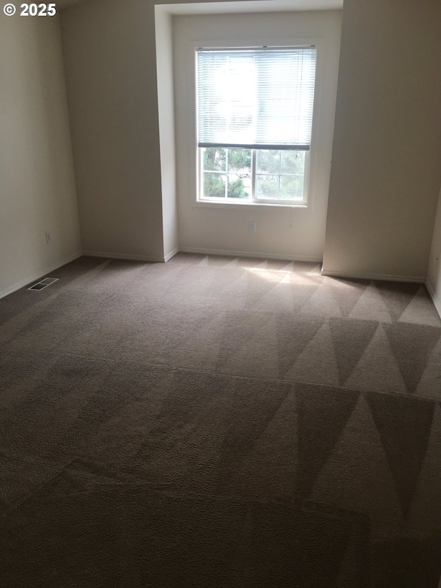 spare room with light colored carpet