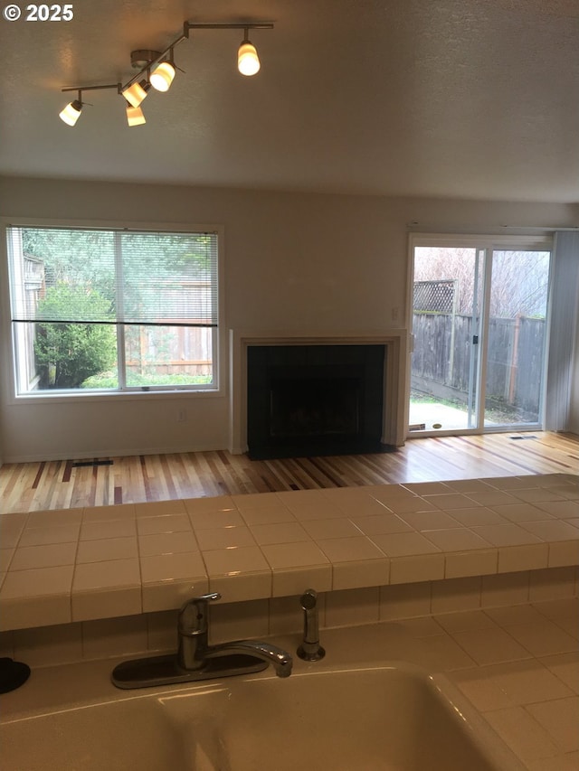 unfurnished living room with track lighting