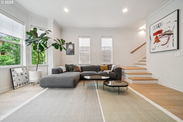 living area featuring recessed lighting, ornamental molding, stairs, and wood finished floors