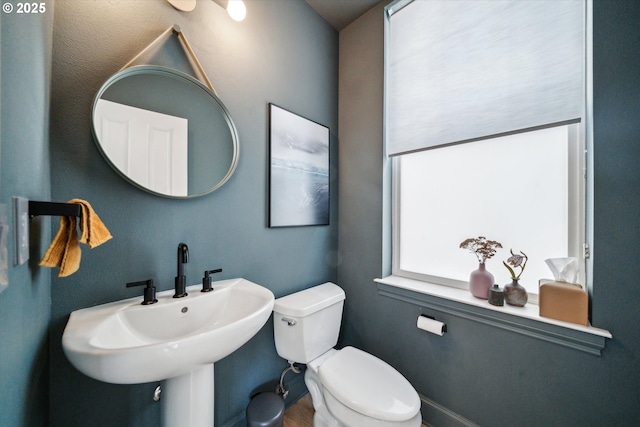 bathroom with a sink and toilet