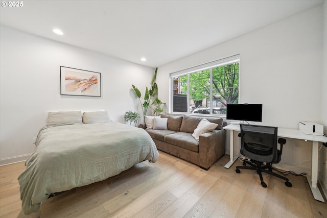 bedroom featuring recessed lighting, baseboards, and light wood-style floors