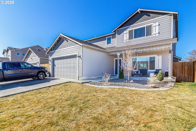 traditional-style house with a garage, a front yard, concrete driveway, and fence