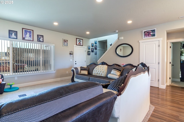 interior space featuring baseboards, wood finished floors, stairs, and recessed lighting