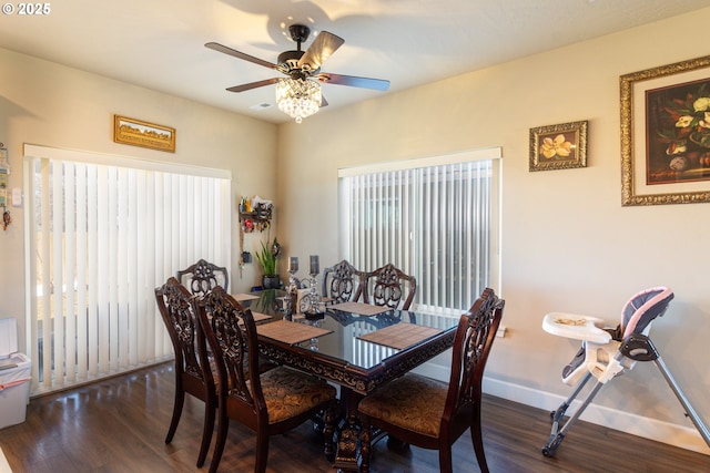 dining area featuring ceiling fan, baseboards, and wood finished floors