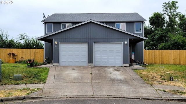 205/207 S 47th St, Springfield, OR 97478 - traditional-style home with concrete driveway, roof with shingles, and an attached garage