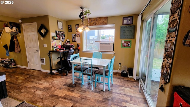 205/207 S 47th St, Springfield, OR 97478 - dining area with plenty of natural light, wood finished floors, heating unit, and cooling unit