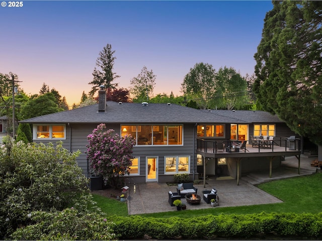 3370 SW Vista Dr, Portland, OR 97225 - rear view of property featuring a patio area, an outdoor fire pit, a deck, a chimney, and central AC unit