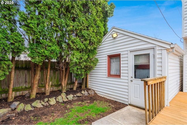 view of outbuilding with an outbuilding and fence