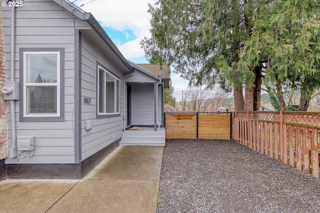 view of side of home with fence