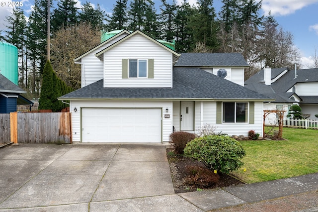 traditional-style home featuring a shingled roof, fence, a front yard, a garage, and driveway