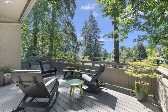 wooden terrace featuring outdoor lounge area