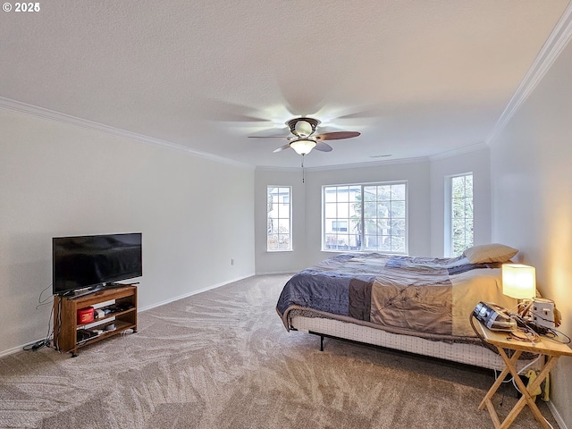 bedroom with ornamental molding, carpet flooring, ceiling fan, a textured ceiling, and baseboards