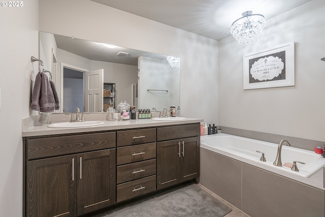 1850 NW Landon St, Mcminnville, OR 97128 - bathroom with double vanity, a chandelier, and a bath