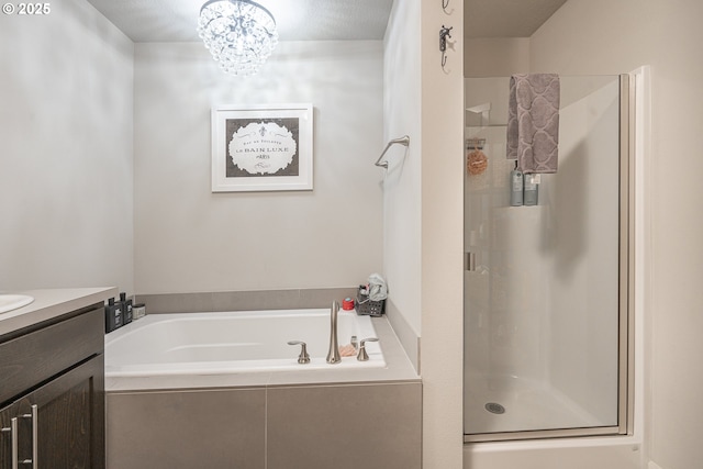 1850 NW Landon St, Mcminnville, OR 97128 - bathroom featuring vanity, a garden tub, a stall shower, and a chandelier