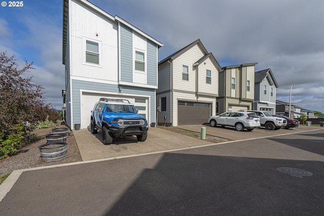 1850 NW Landon St, Mcminnville, OR 97128 - townhome / multi-family property featuring an attached garage, concrete driveway, and a residential view