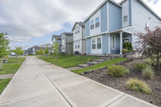 1850 NW Landon St, Mcminnville, OR 97128 - view of side of home with a residential view, a yard, and central AC