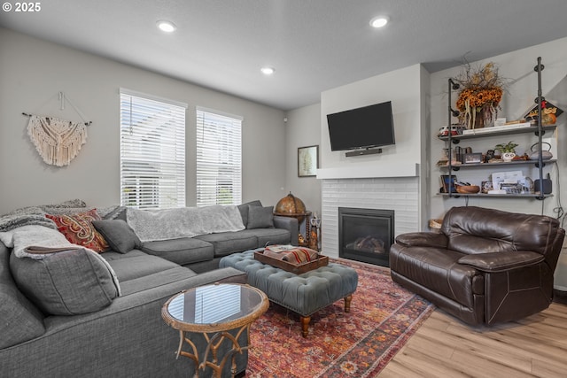 1850 NW Landon St, Mcminnville, OR 97128 - living area featuring light wood-style flooring, a fireplace, and recessed lighting