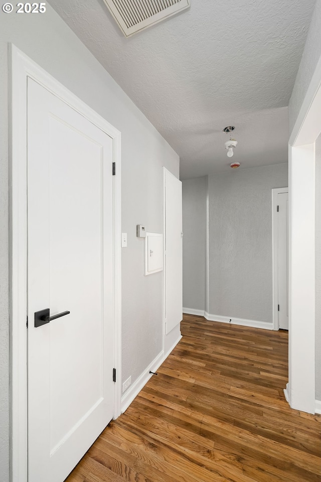 320 SE 106th Ave, Portland, OR 97216 - corridor with wood finished floors and a textured ceiling