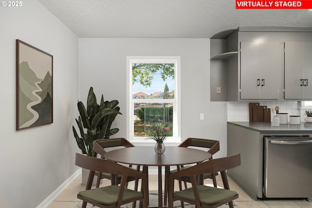320 SE 106th Ave, Portland, OR 97216 - dining space featuring light tile patterned floors and a textured ceiling