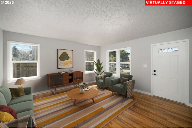 320 SE 106th Ave, Portland, OR 97216 - living area featuring wood finished floors and a textured ceiling