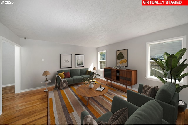 320 SE 106th Ave, Portland, OR 97216 - living room featuring a textured ceiling and wood finished floors