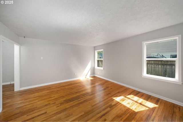 320 SE 106th Ave, Portland, OR 97216 - spare room featuring a textured ceiling and wood finished floors