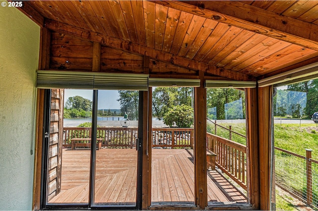 77993 Point Adams Rd, Clatskanie, OR 97016 - doorway to outside featuring a textured wall, lofted ceiling, and a water view