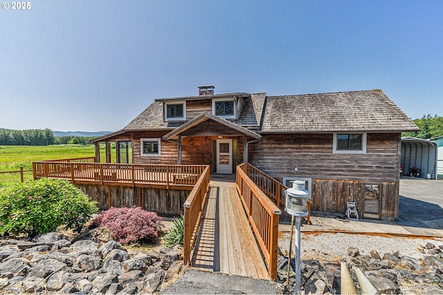 77993 Point Adams Rd, Clatskanie, OR 97016 - view of front of property with a wooden deck and a chimney
