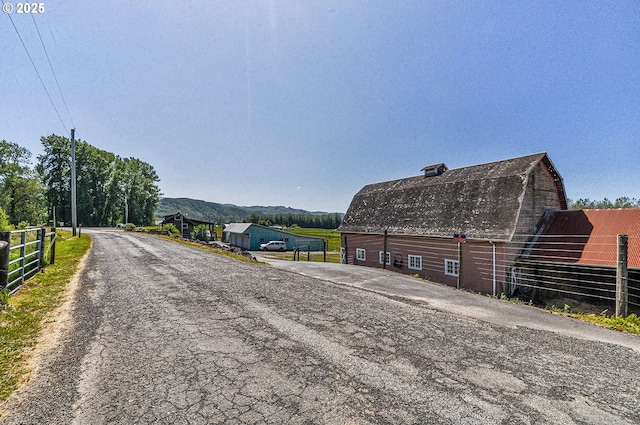 77993 Point Adams Rd, Clatskanie, OR 97016 - view of asphalt street with a barn and a mountain view