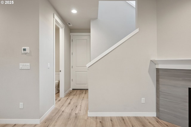 interior space with recessed lighting, light wood-type flooring, baseboards, and visible vents