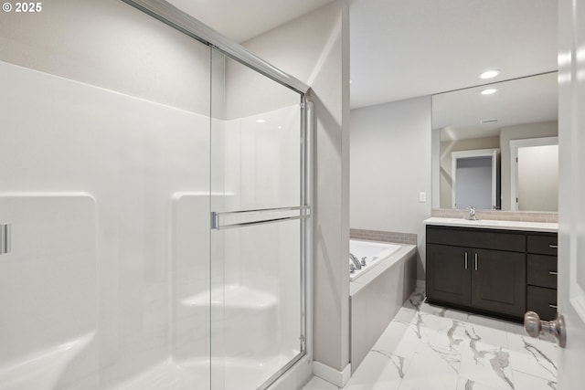 full bath featuring marble finish floor, a stall shower, and a bath