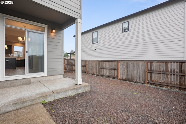 view of yard featuring a patio and fence