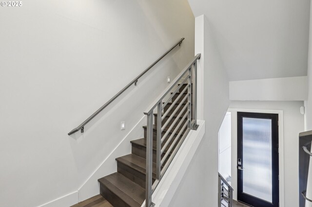 stairway featuring wood finished floors