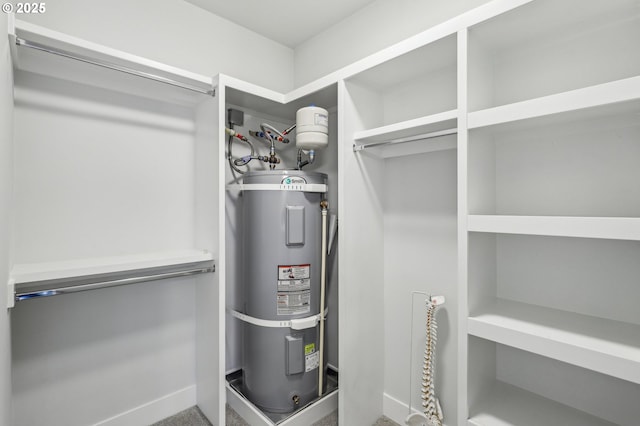 walk in closet featuring strapped water heater