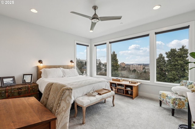 carpeted bedroom featuring baseboards, a ceiling fan, and recessed lighting