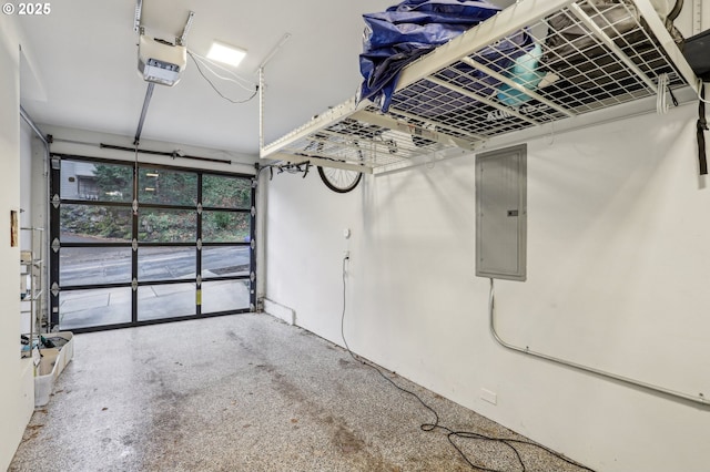 garage featuring electric panel and a garage door opener