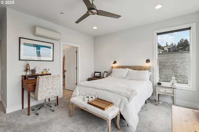 bedroom featuring an AC wall unit, recessed lighting, light colored carpet, baseboards, and ceiling fan