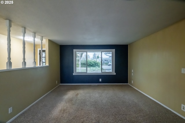 spare room featuring carpet