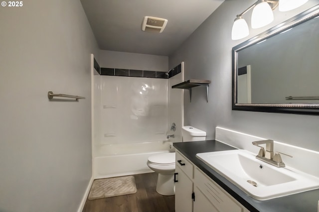 full bathroom featuring toilet, shower / bathtub combination, wood-type flooring, and vanity