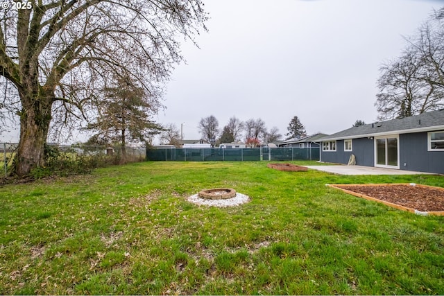 view of yard featuring a patio area and a fire pit