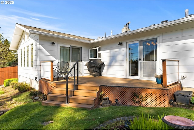 rear view of house featuring a deck