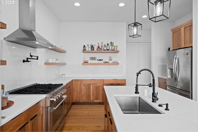 9316 NW Hardy Ave, Portland, OR 97231 - kitchen featuring stainless steel appliances, wall chimney exhaust hood, a sink, open shelves, and recessed lighting
