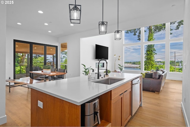 9316 NW Hardy Ave, Portland, OR 97231 - kitchen with a sink, plenty of natural light, recessed lighting, light wood-style floors, and decorative light fixtures