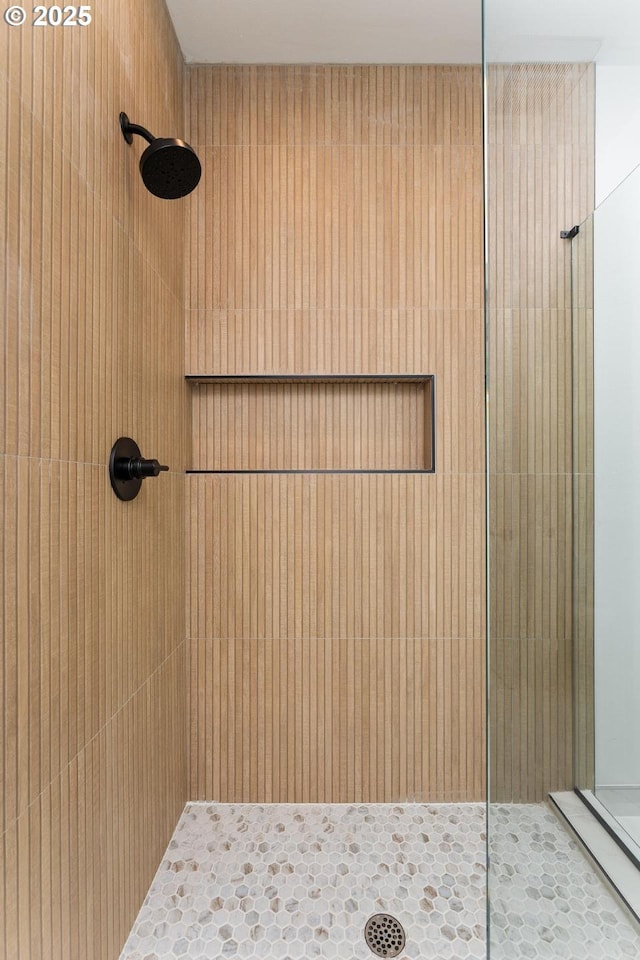 full bathroom with tiled shower