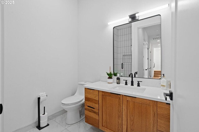 9316 NW Hardy Ave, Portland, OR 97231 - bathroom with vanity, marble finish floors, toilet, and an enclosed shower