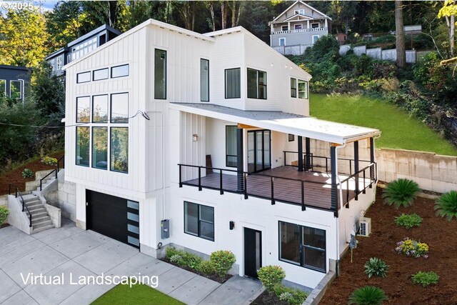 exterior space featuring concrete driveway, an attached garage, board and batten siding, and a balcony