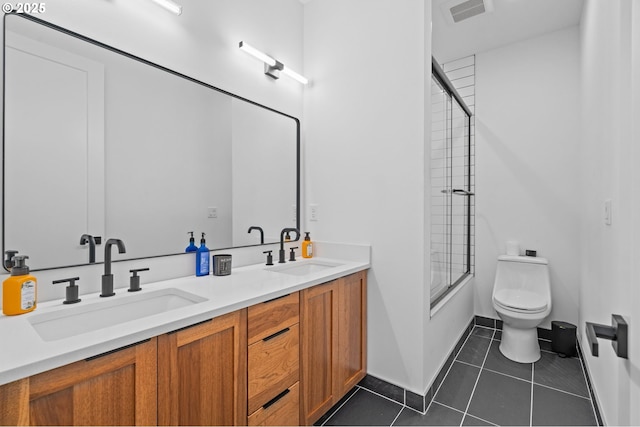 9316 NW Hardy Ave, Portland, OR 97231 - full bath with double vanity, toilet, tile patterned floors, and enclosed tub / shower combo