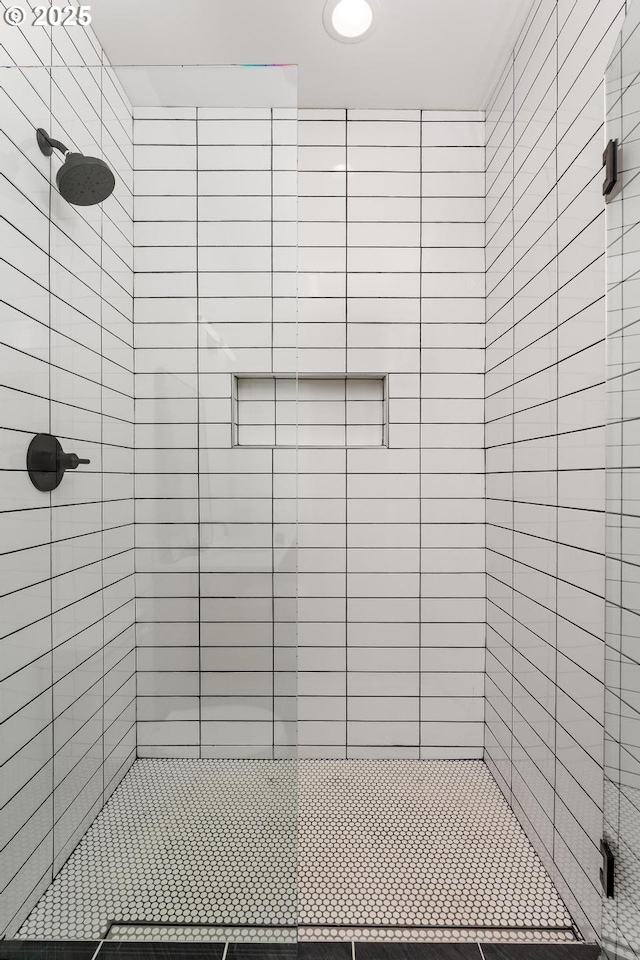 bathroom with a shower stall